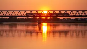Finding the most efficient path across river for new railroad bridges