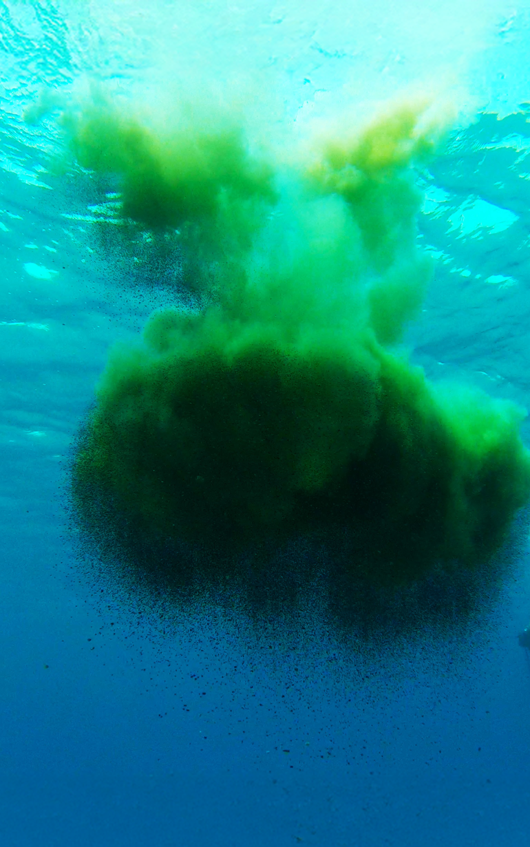 Ship dredging in turqouoise water